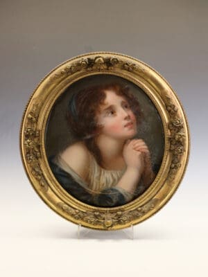 A Mid-19th Century English School Oval Portrait of a Young Woman
